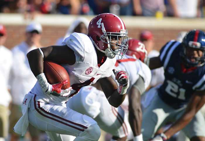 Alabama Crimson Tide defensive back Eddie Jackson (4) returns a kick during the third quarter of the game against the Mississippi Rebels at Vaught-Hemingway Stadium in 2016. Alabama won 48-43.